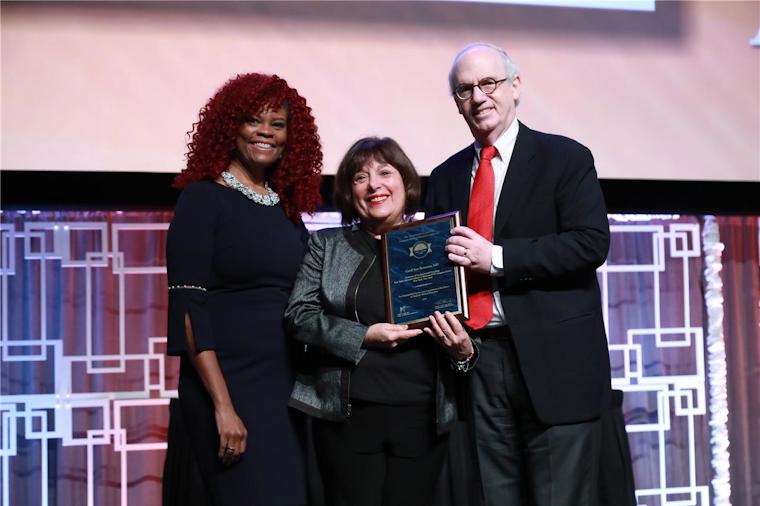 2019 Gienapp Awardee Dr. Carol Bernstein is presented her award at the 2019 Annual Educational Conference