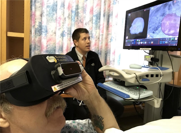 Dr. James Wright guides a patient through a virtual reality simulation of the pending procedure