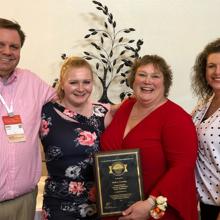 Kelli Corning with family and friends after receiving the 2019 ACGME GME Coordinator Excellence Award at the Annual Educational Conference